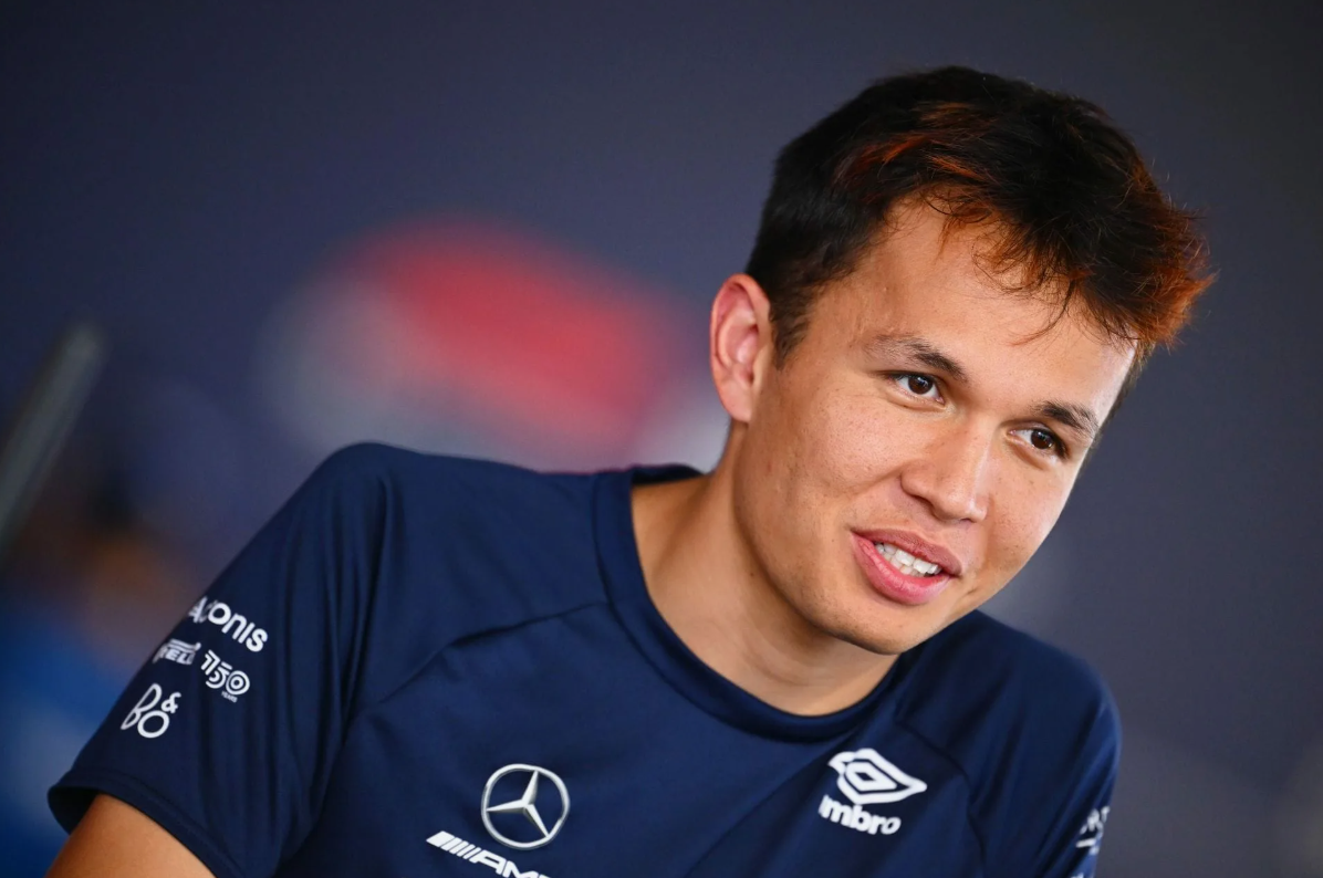 Alex Albon surrounded by his pet cats at home
