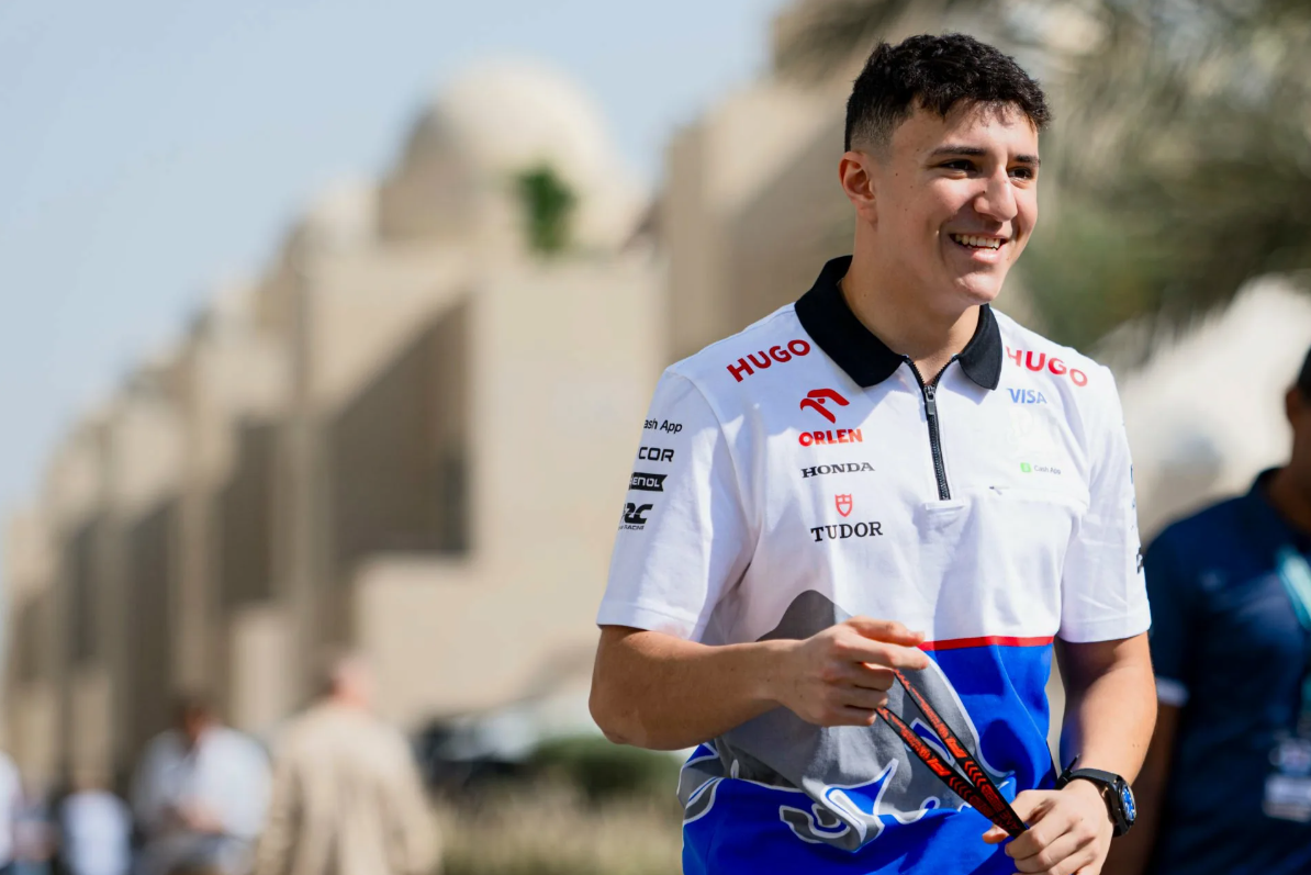 Isack Hadjar attempting to defend his position against Charles Leclerc during a race