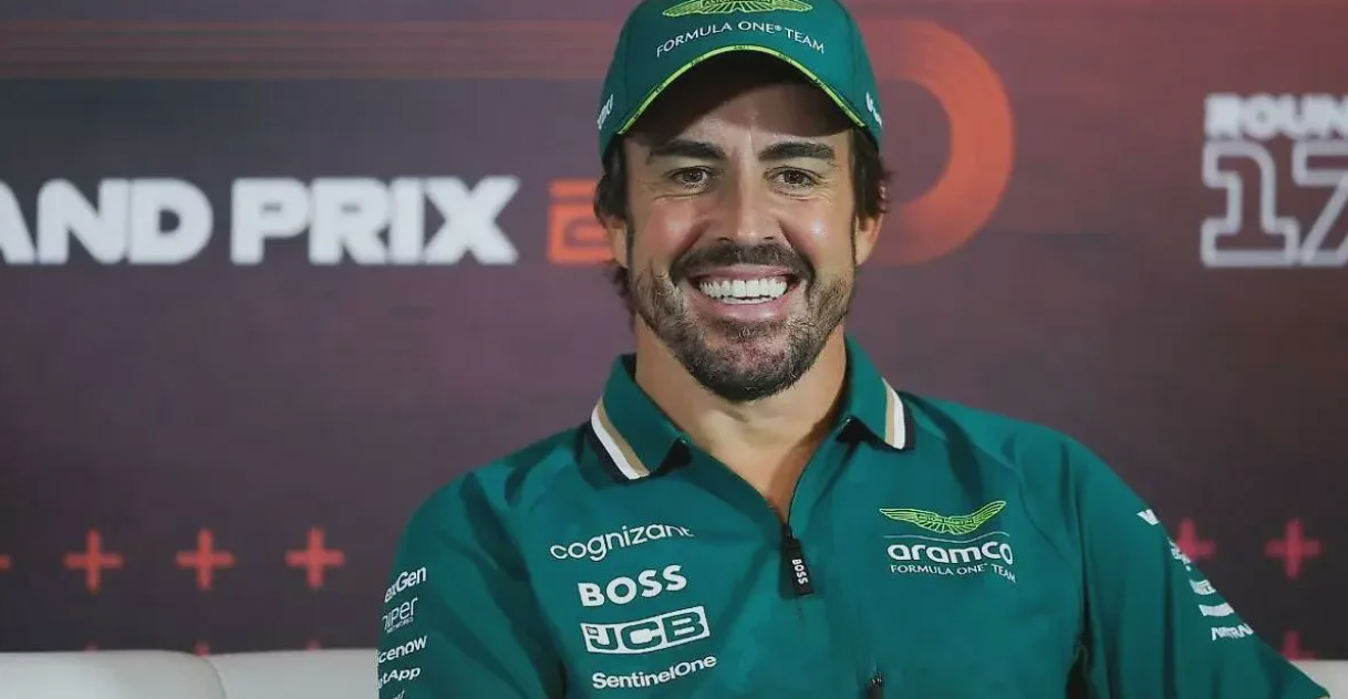 Fernando Alonso working with Aston Martin team in the garage