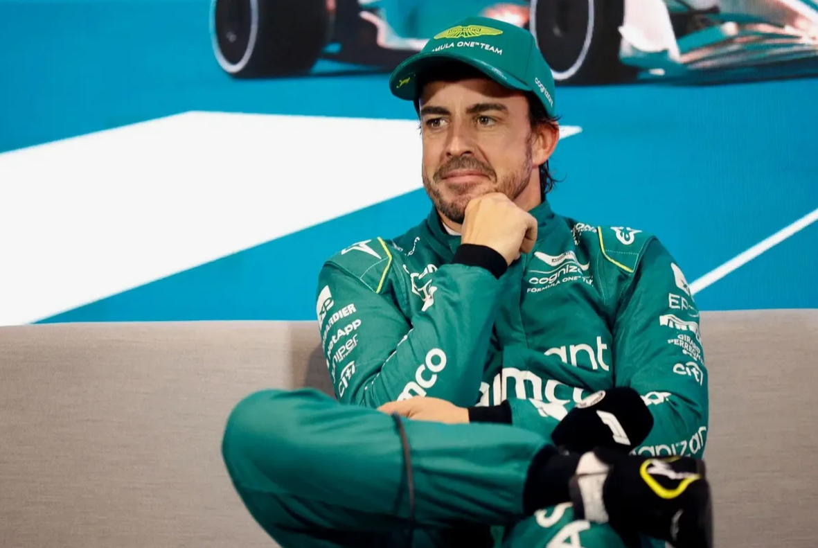 Fernando Alonso working with Aston Martin team in the garage