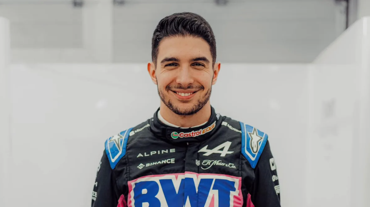 Esteban Ocon preparing for a race with focused expression