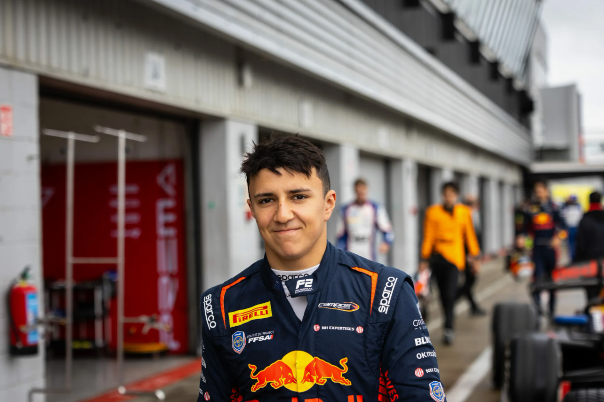 Racing cars in a tense wheel-to-wheel moment during a Formula race weekend