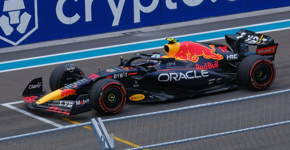 Professional driver using a high-tech simulator designed with Formula 1 technologies for performance development and race preparation.