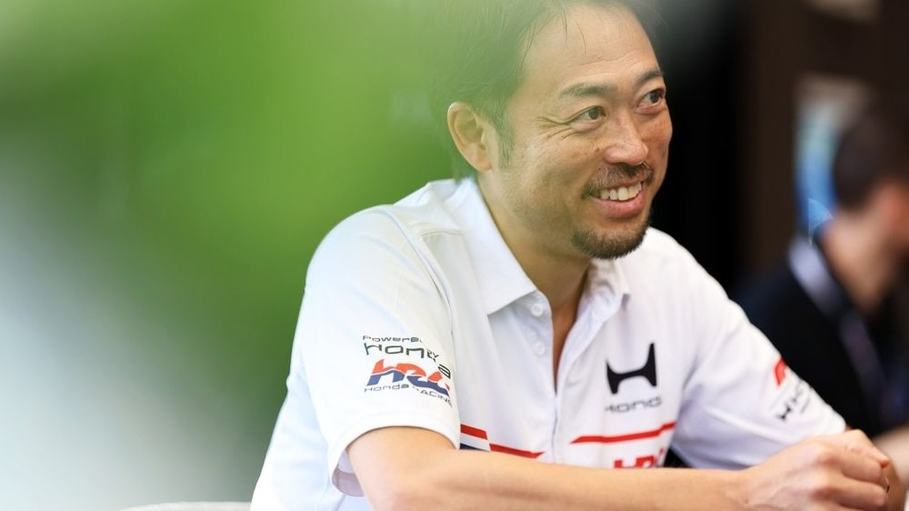 A Honda Racing Corporation representative speaks in the Formula 1 paddock