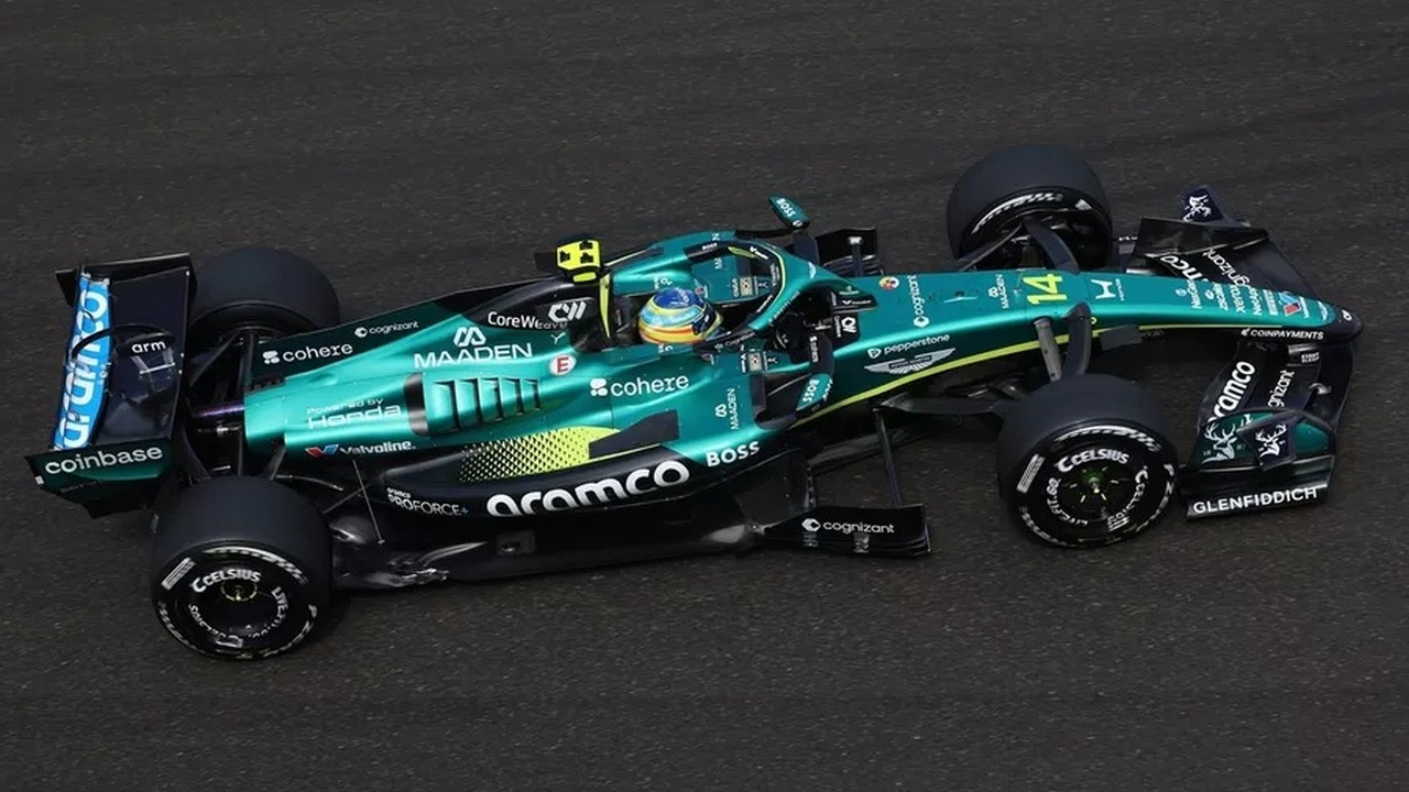 An Aston Martin Formula 1 car is shown from the side on track