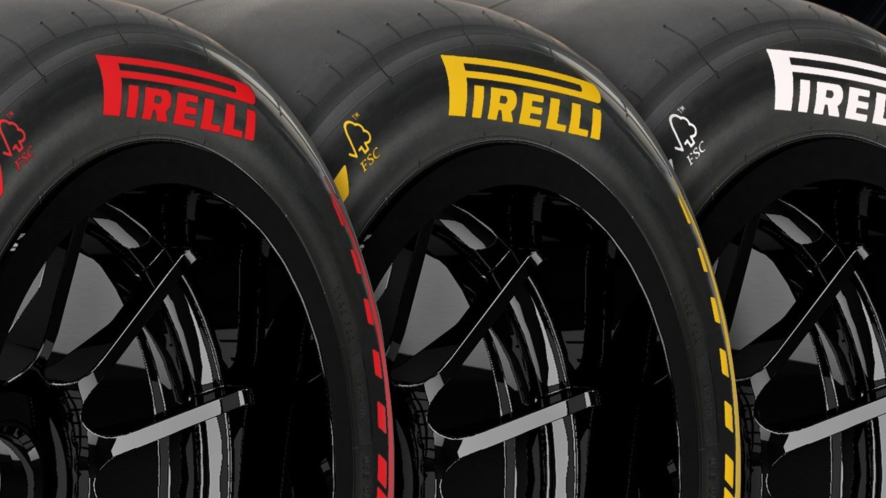Pirelli Formula 1 tyres stand beside a racing circuit