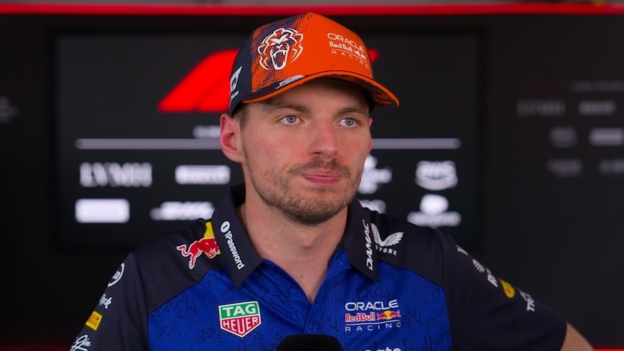 Max Verstappen speaks in his Red Bull race suit