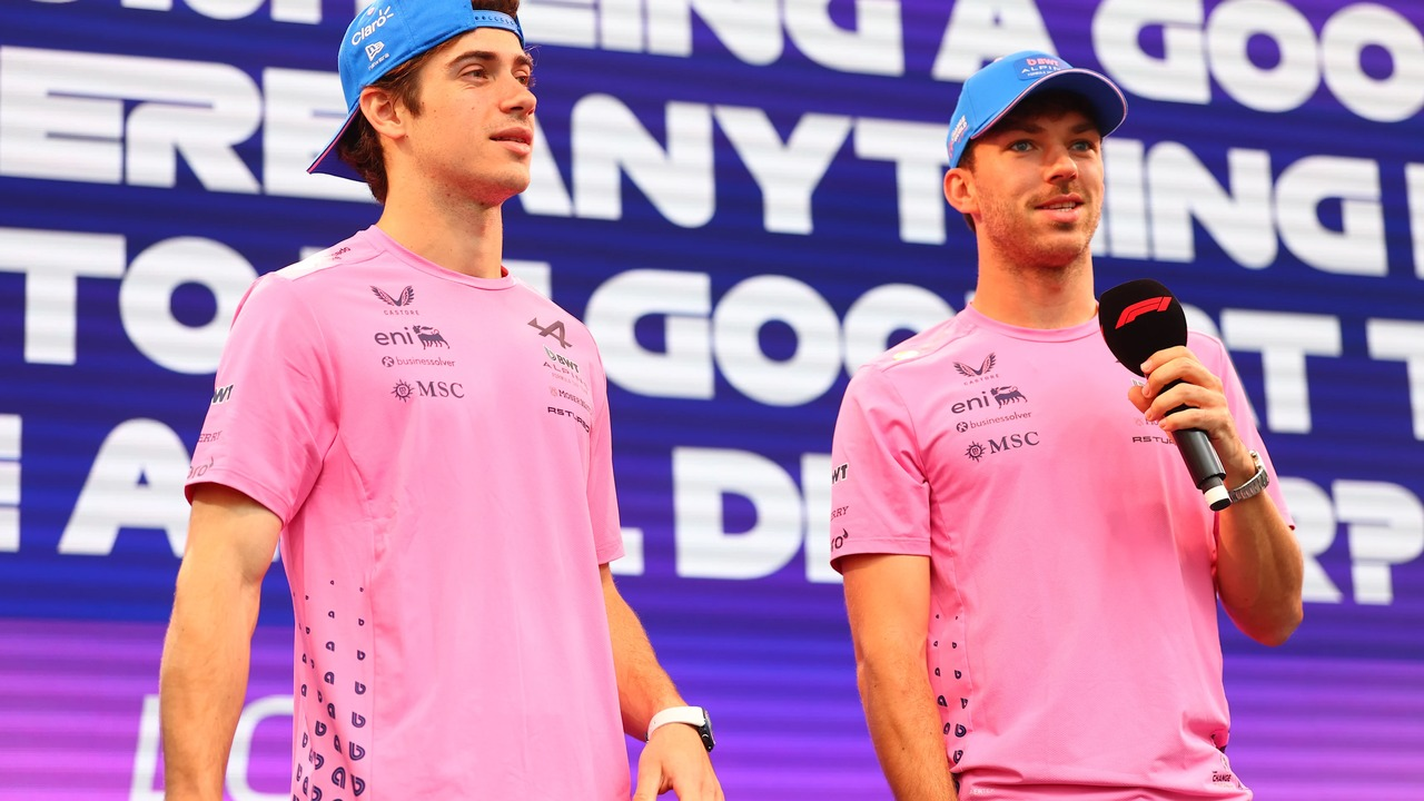 Pierre Gasly and Franco Colapinto stand in Alpine team clothing