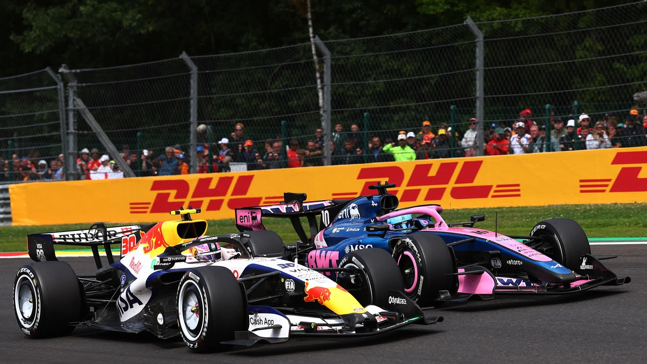 Two Alpine Formula 1 cars drive on the circuit