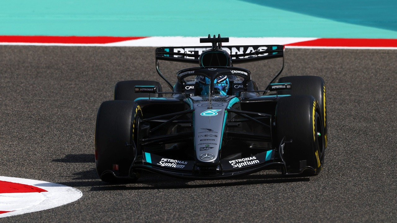A Mercedes Formula 1 car runs on track