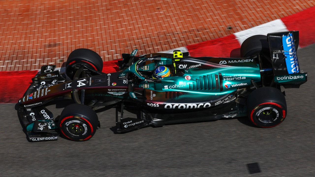 An Aston Martin Formula 1 car runs on the circuit