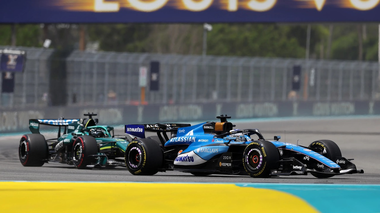 Two Formula 1 cars race side by side in Barcelona