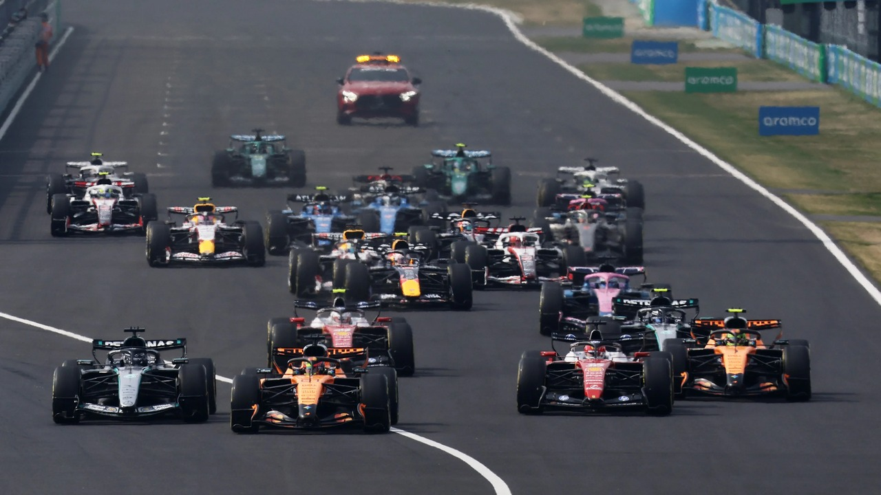 Formula 1 cars leave the grid at the start of a race