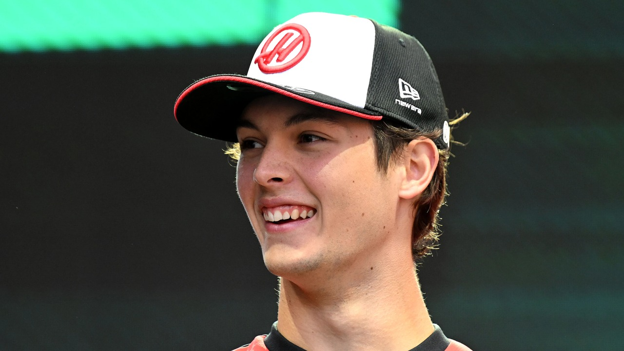 Oliver Bearman stands in Haas team clothing