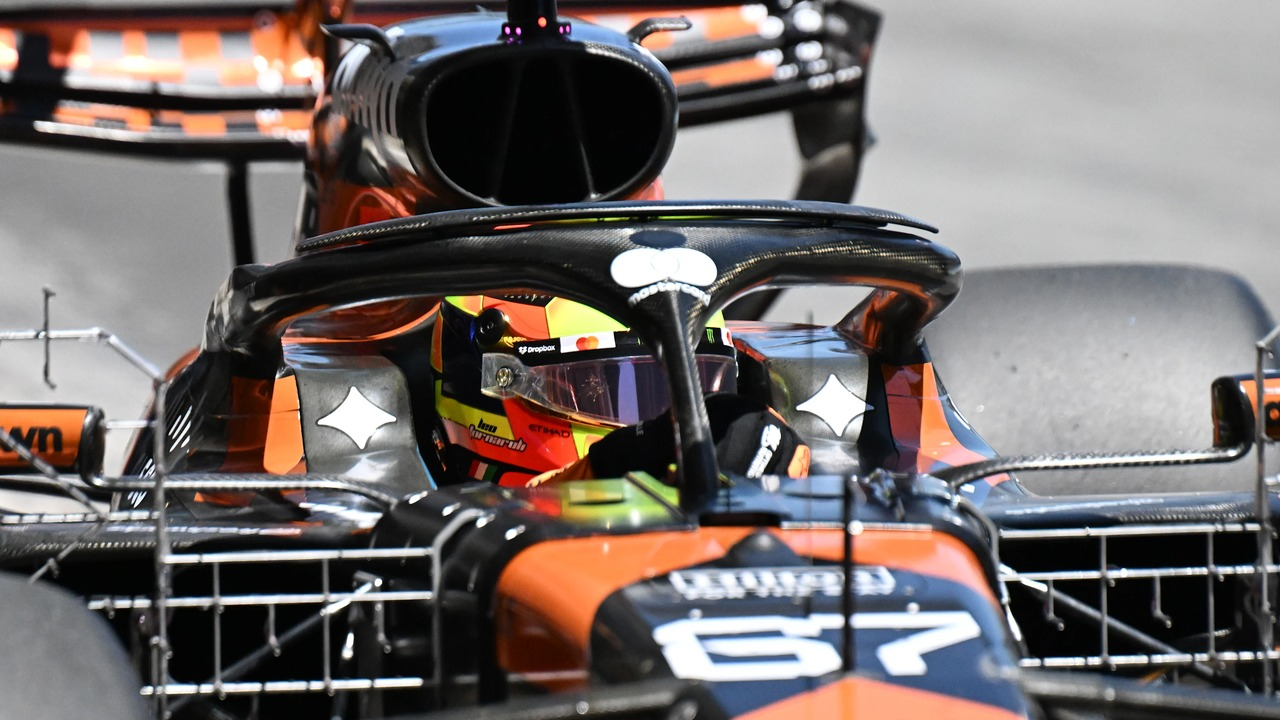 Leonardo Fornaroli sits in a McLaren Formula 1 car wearing his helmet