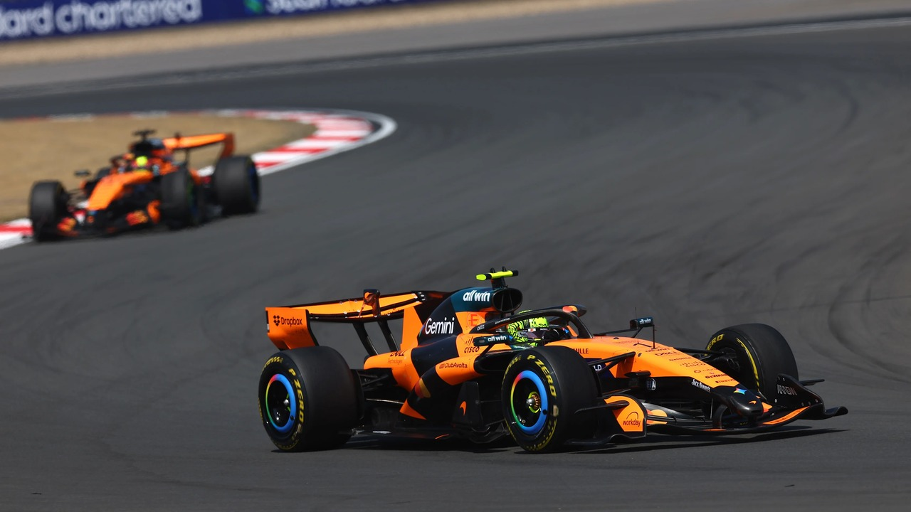 Two McLaren Formula 1 cars race on the same circuit