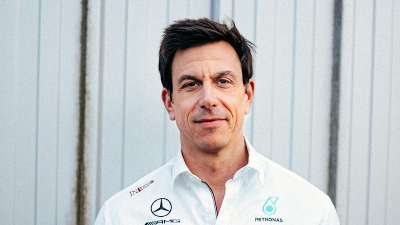 Toto Wolff stands in a Mercedes team shirt